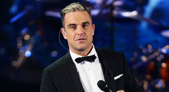 Robbie Williams da una probada de un nuevo tema escrito por The Killers